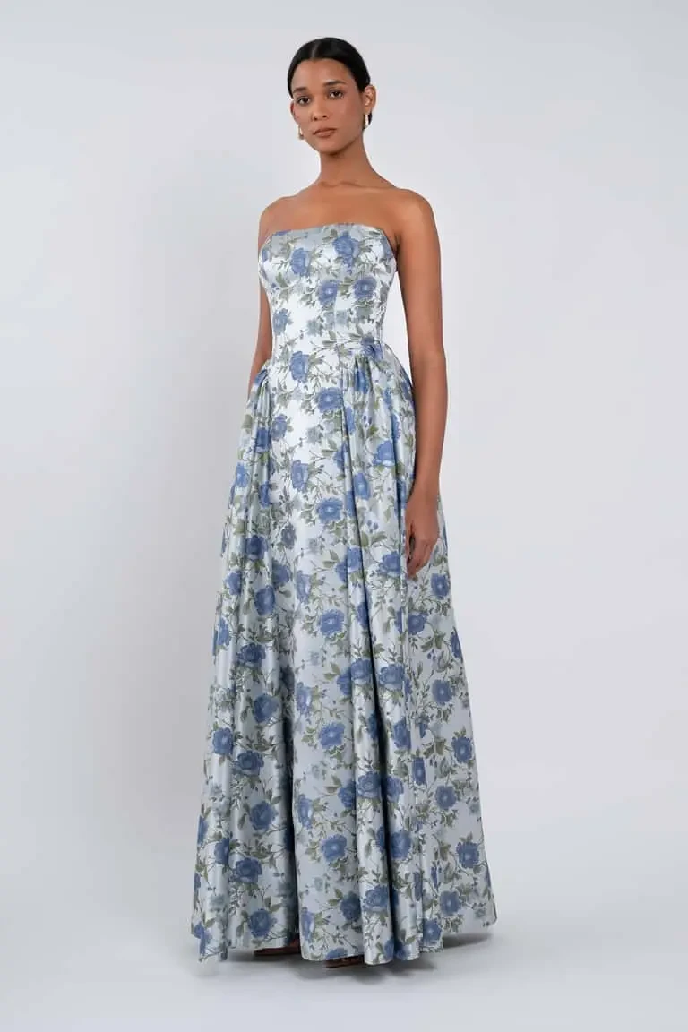 model is wearing a strapless floral a-line bridesmaid dress by jenny yoo