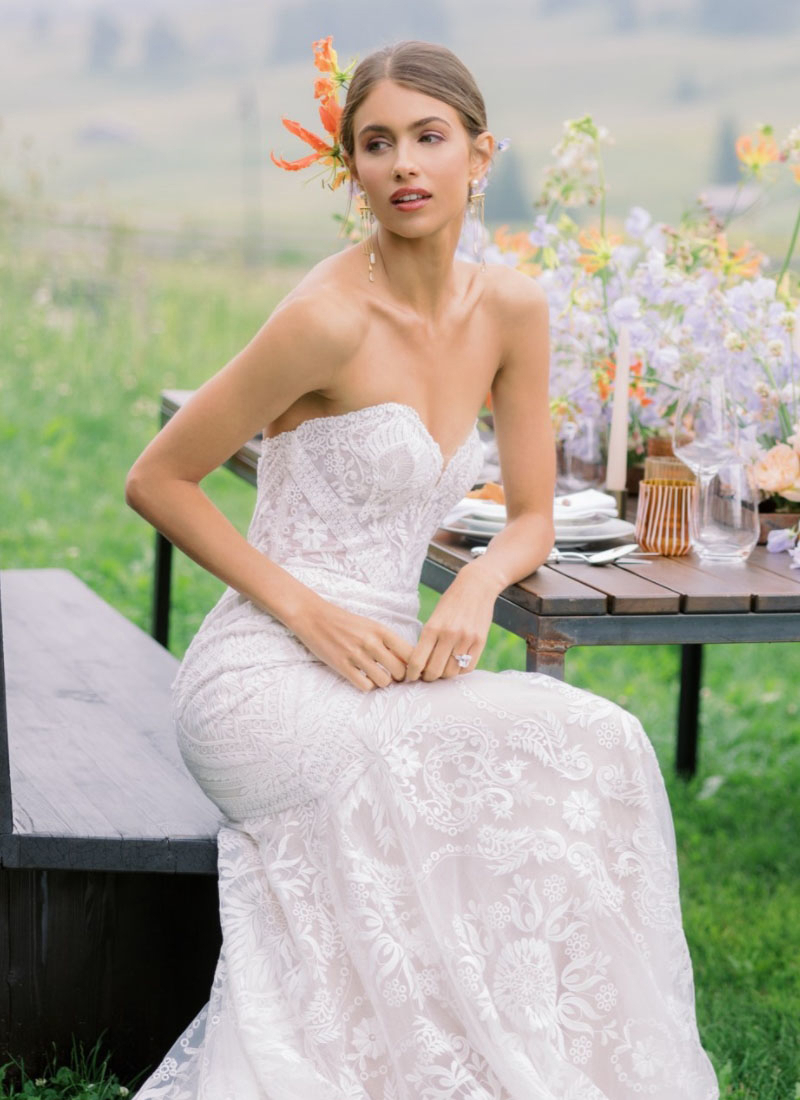 Model wearing a white gown by WTOO