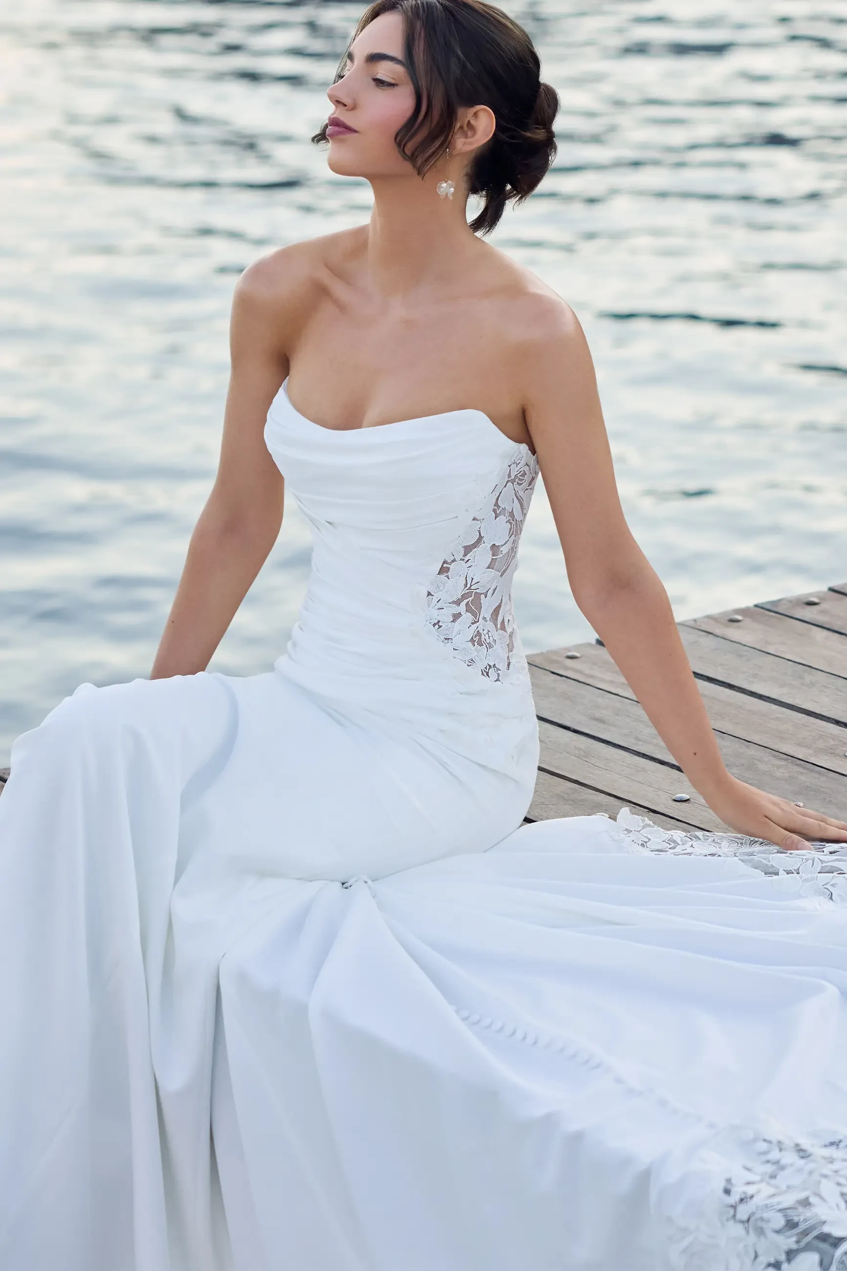 model is wearing a sophia tolli wedding dress